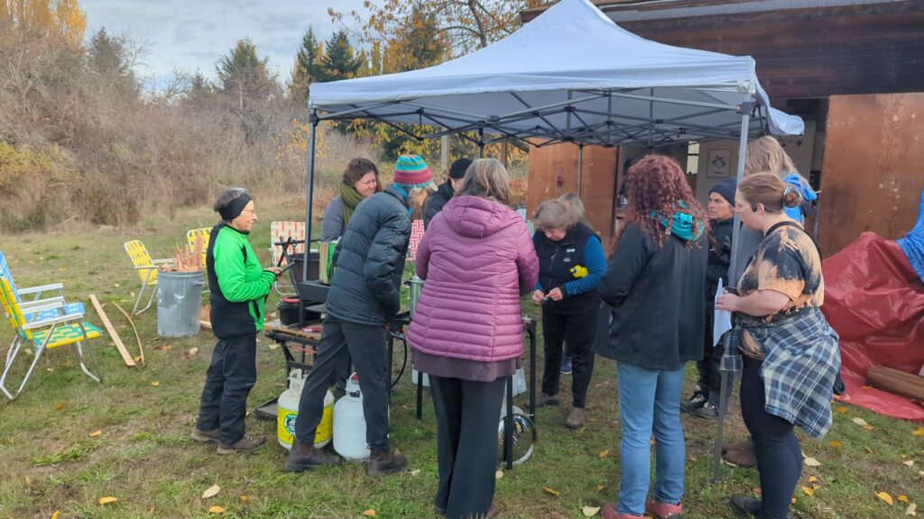 a group of people gather under a tent